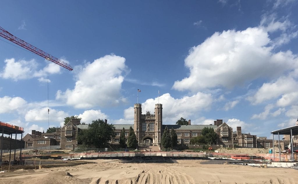 A massive expanse of sand extends out in front of Brookings Hall on the campus of Washington University in St. Louis