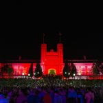 Brookings Hall on the campus of Washington University in St. Louis is lit fed to celebrate Convocation.